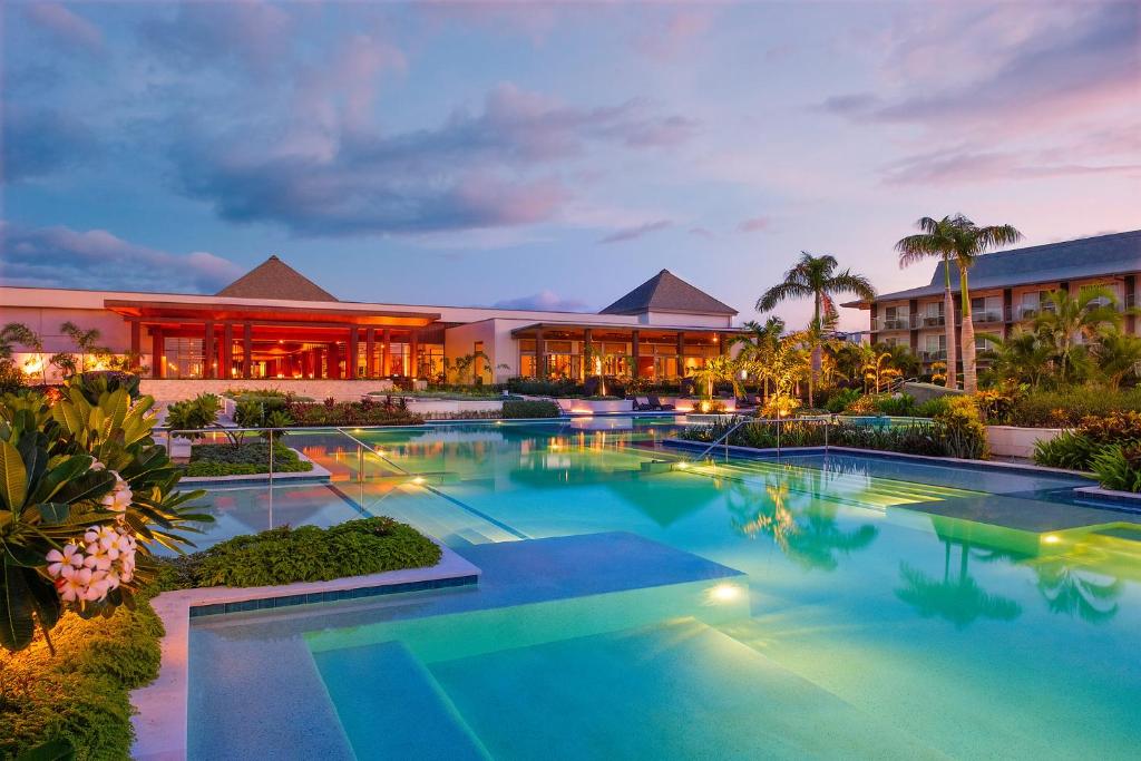 a large swimming pool in front of a building at Crowne Plaza Fiji Nadi Bay Resort & Spa, an IHG Hotel in Nadi