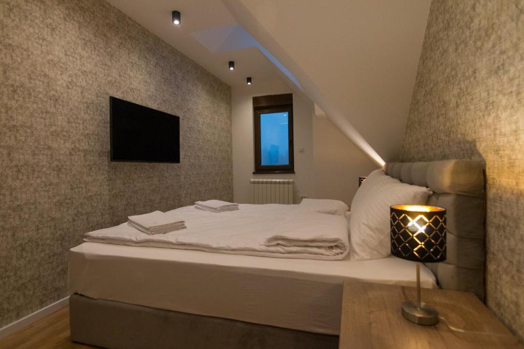 Postel nebo postele na pokoji v ubytování Tara Lux apartmani
