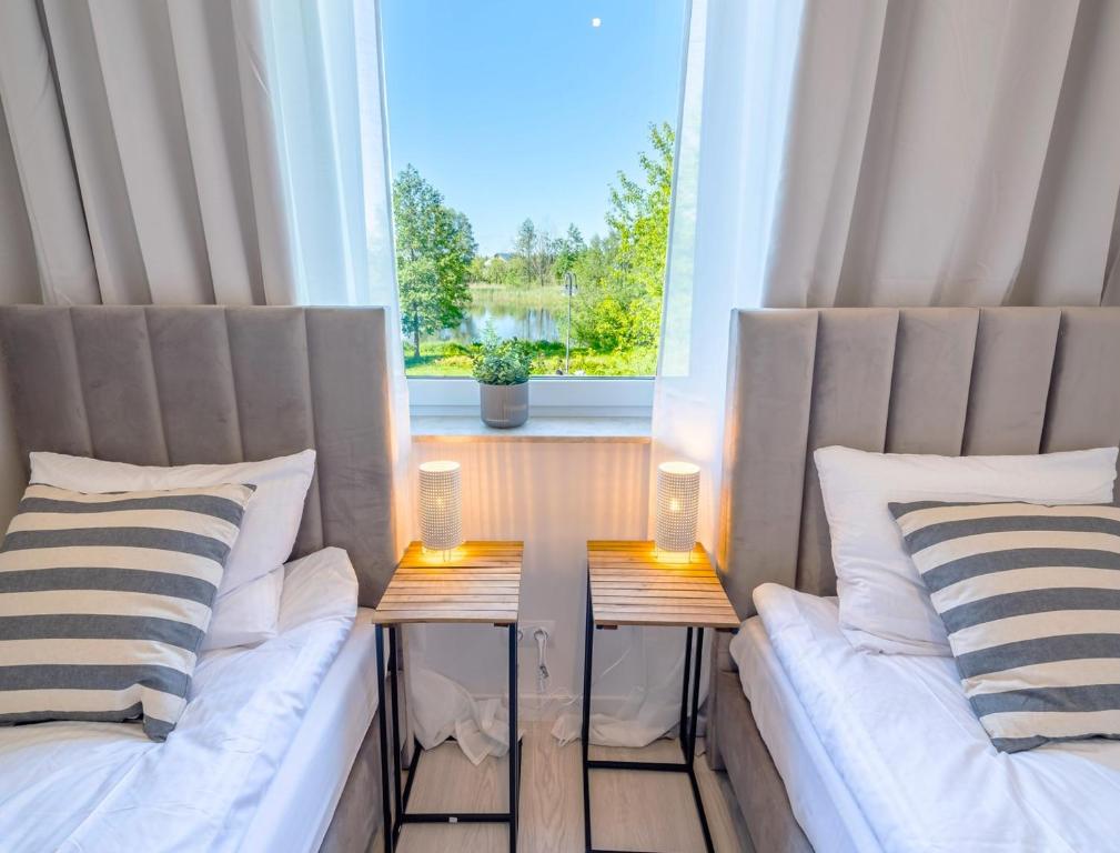 Posteľ alebo postele v izbe v ubytovaní Unique View Apartment - 3pok, 4 łóżka, widok na rzekę, centrum, Netflix, parking, winda
