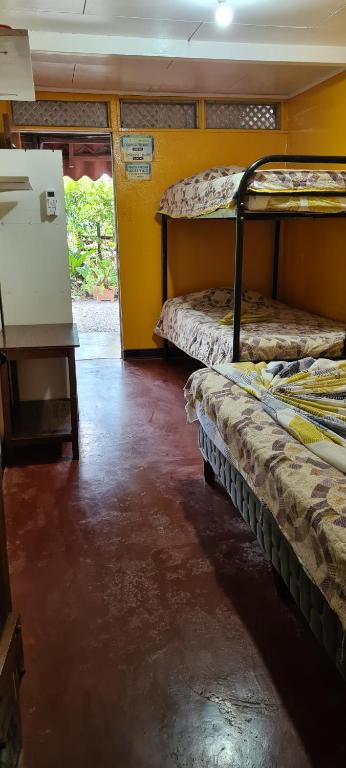 Postel nebo postele na pokoji v ubytování Congos Hostal y Camping