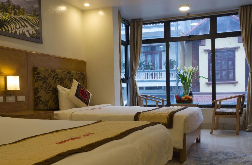 Giường trong phòng chung tại Sapa Snow Hotel