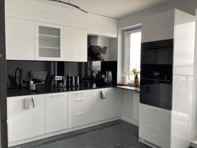 A cozinha ou cozinha compacta de Cozy apartment near Park Chorzowski