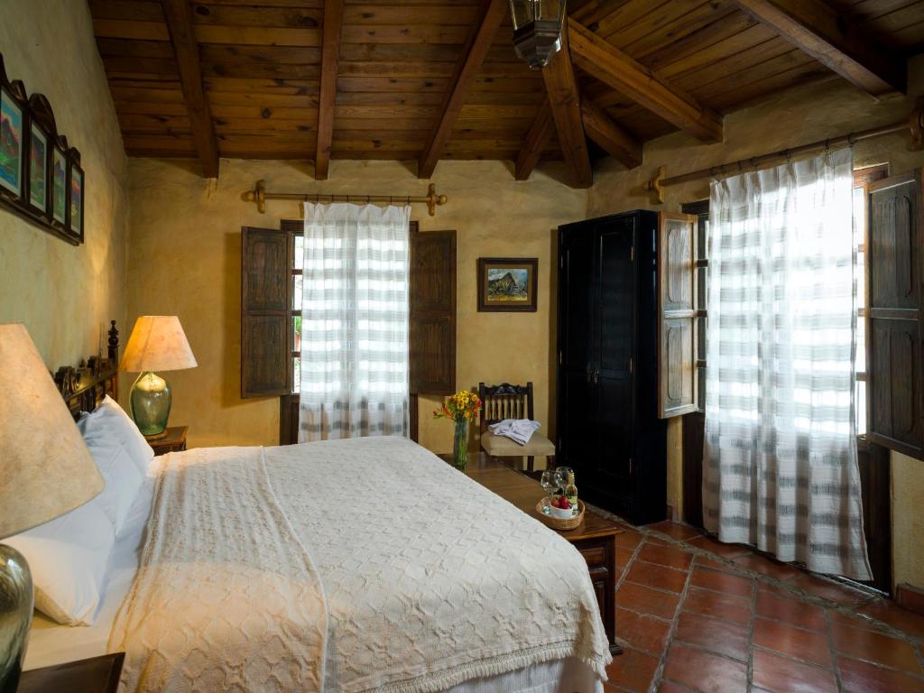 Postel nebo postele na pokoji v ubytování Hotel Casona de Manzano