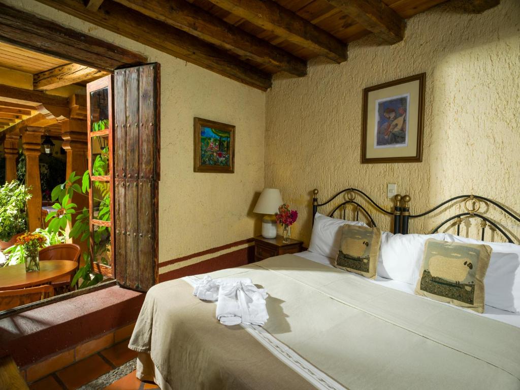 Postel nebo postele na pokoji v ubytování Hotel Casona de Manzano