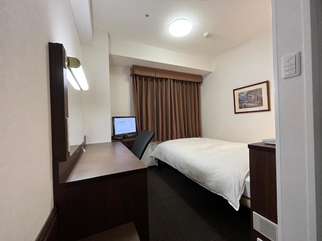 Postel nebo postele na pokoji v ubytování Hotel Alpha-One Kurashiki