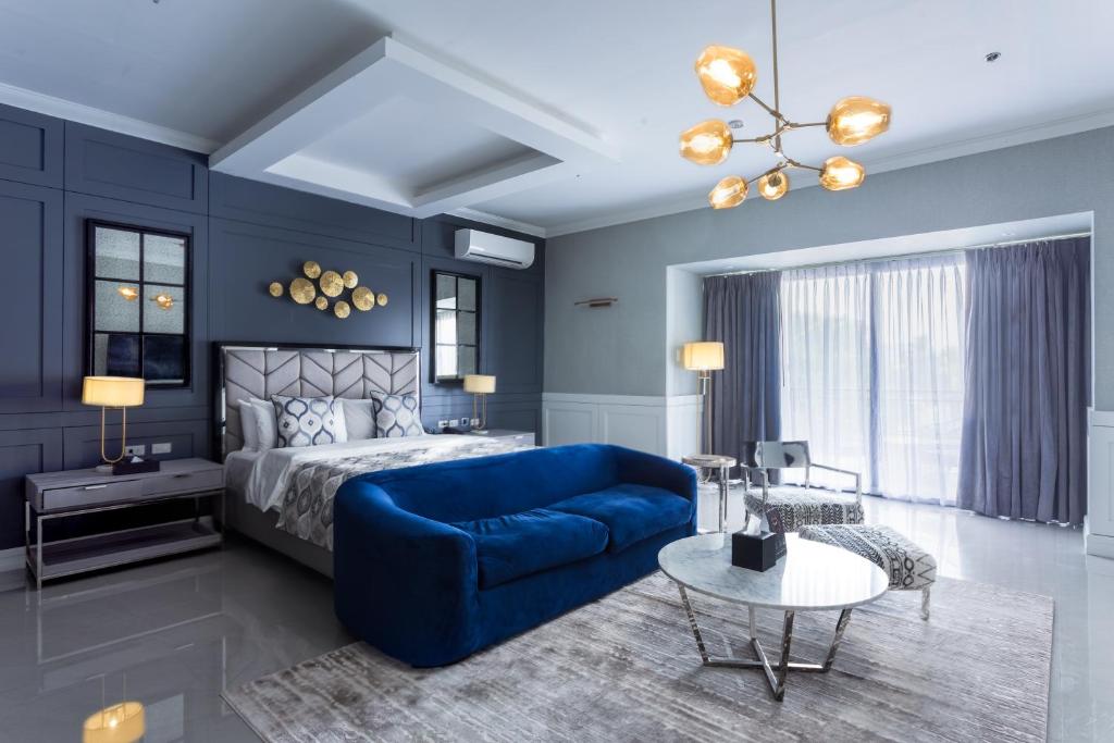Postel nebo postele na pokoji v ubytování Stonehill Suites
