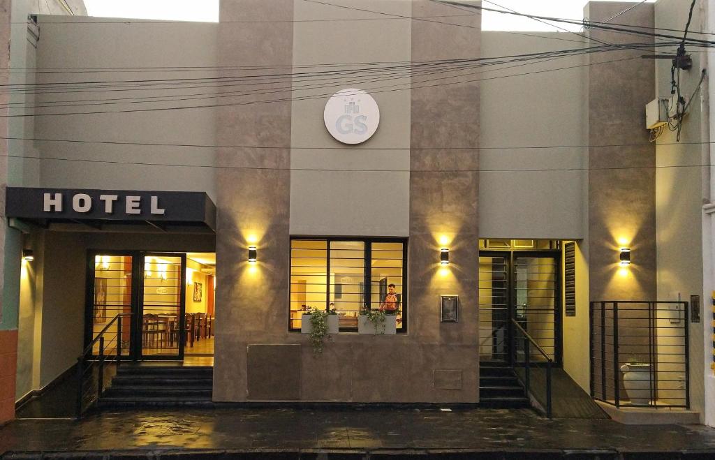 a hotel with a clock on the side of a building at GS Hotel in Salta