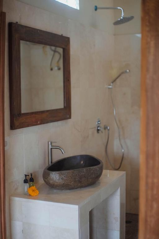 Koupelna v ubytování Nirwa 1 Ubud Guesthouse