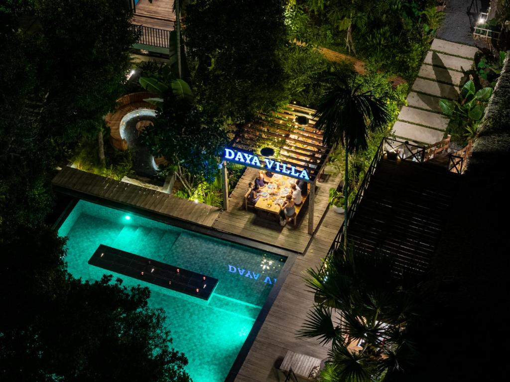 an overhead view of a swimming pool at night at Daya Villa in Kampot