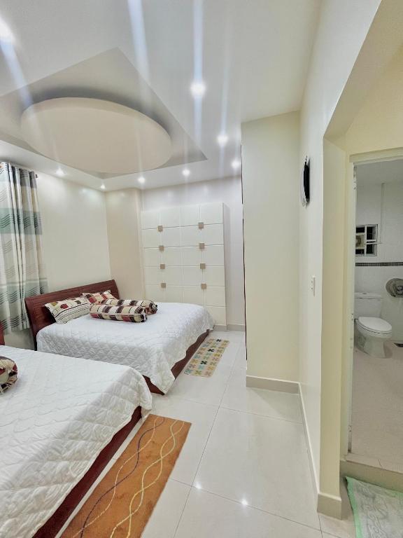 Postel nebo postele na pokoji v ubytování Cherry Homestay - Hoàng Đế motel