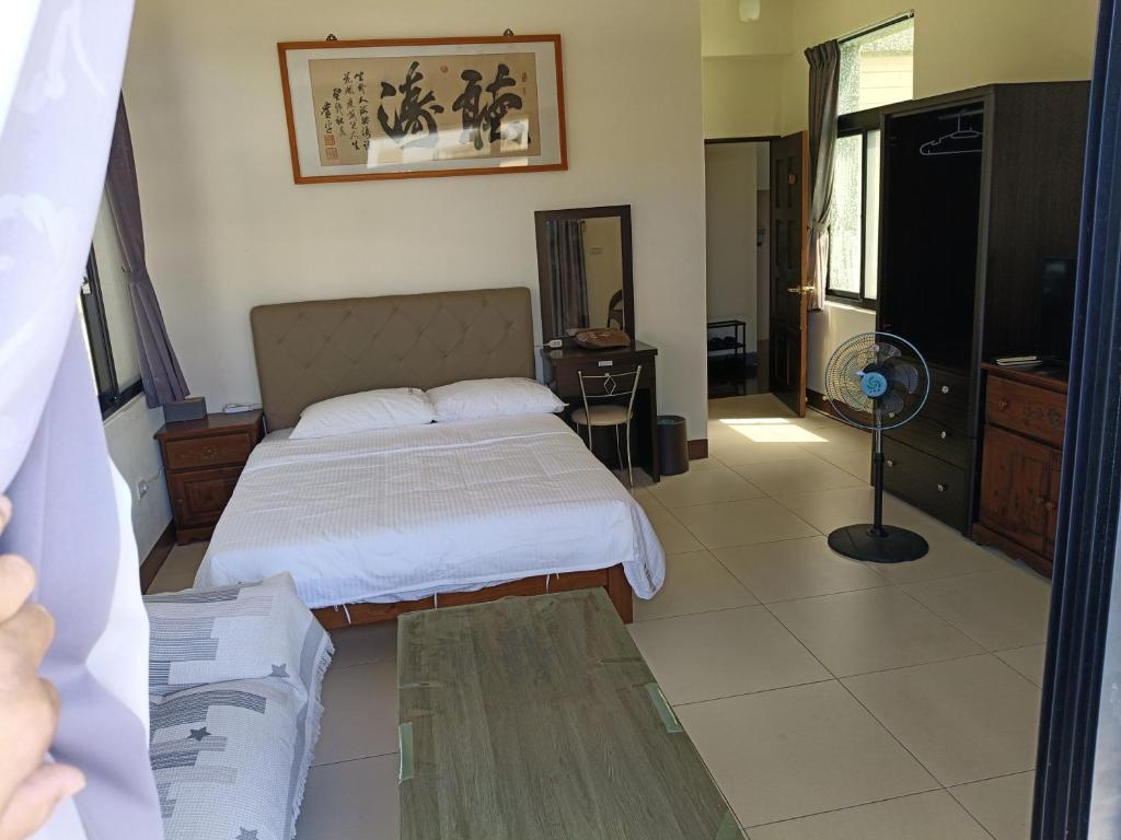 Postel nebo postele na pokoji v ubytování Yan Gui Lai B&B