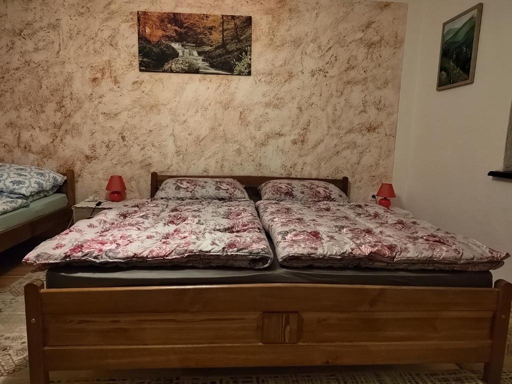 a bed sitting in a bedroom with at Mária in Košice