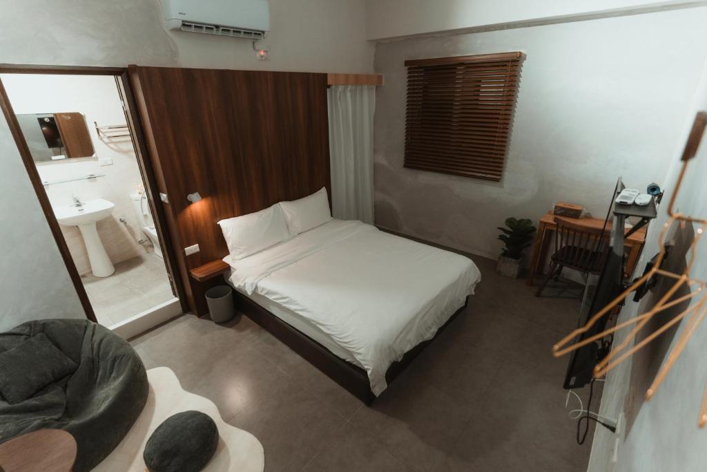Postel nebo postele na pokoji v ubytování 木子寓所 Moozhouse