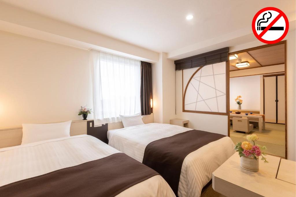 Postel nebo postele na pokoji v ubytování Choshi Plaza Hotel