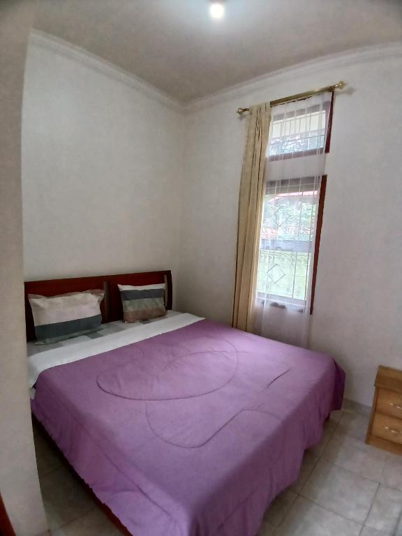 Postel nebo postele na pokoji v ubytování Hotel MBC Ruteng