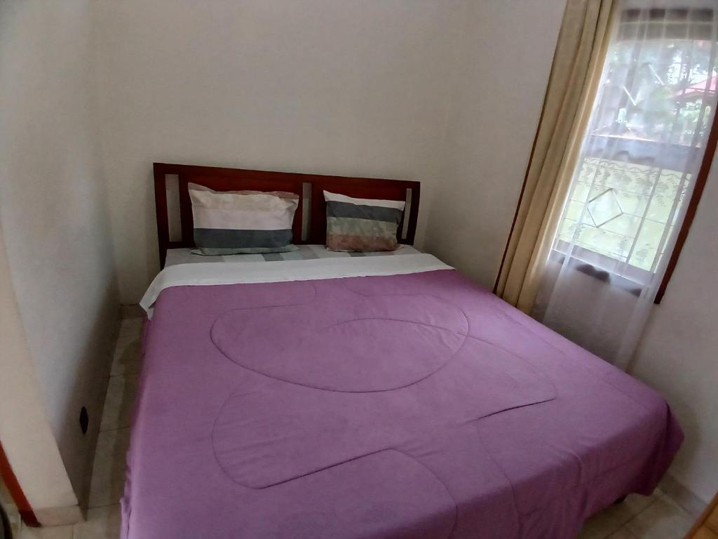 Postel nebo postele na pokoji v ubytování Hotel MBC Ruteng