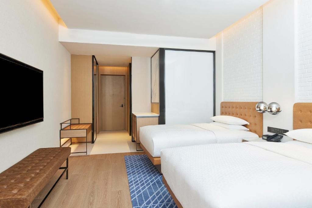 Postel nebo postele na pokoji v ubytování Four Points by Sheraton Xi’an High-Tech Zone