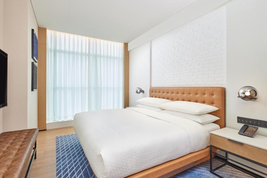 Postel nebo postele na pokoji v ubytování Four Points by Sheraton Xi’an High-Tech Zone