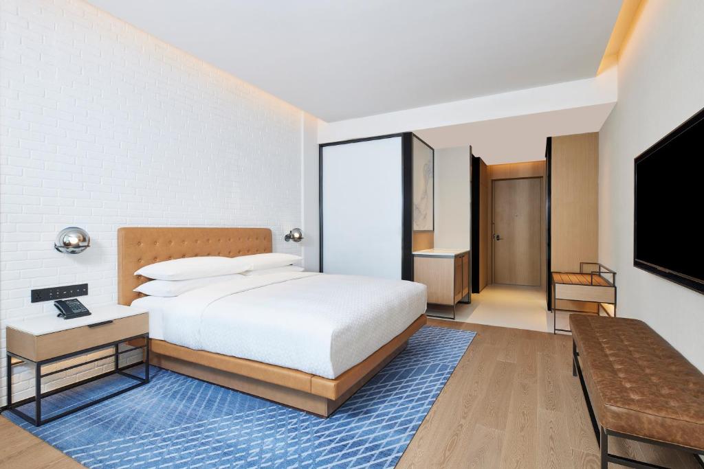 Postel nebo postele na pokoji v ubytování Four Points by Sheraton Xi’an High-Tech Zone