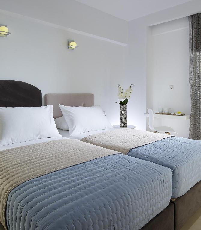 Posteľ alebo postele v izbe v ubytovaní Coral Hotel