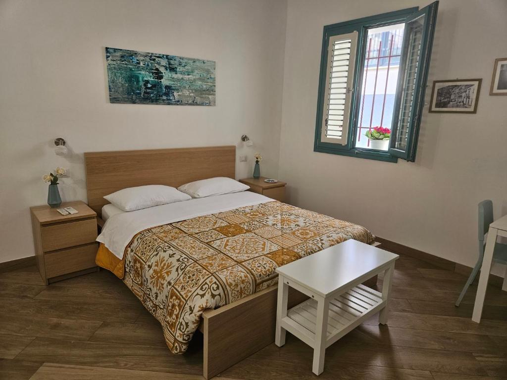 Postel nebo postele na pokoji v ubytování B&B Mormina