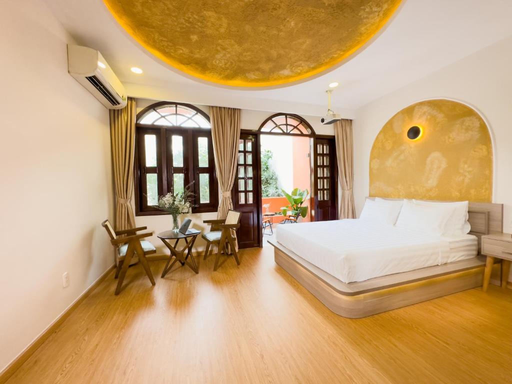 a bedroom with a bed and a large orb on the ceiling at AIRIE LIVING in Ho Chi Minh City