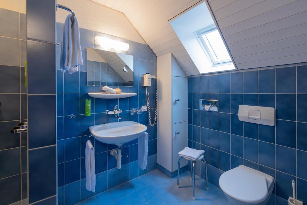 Koupelna v ubytování Hotel Adler