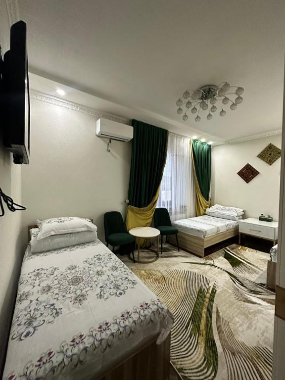 Postel nebo postele na pokoji v ubytování Sultan Saray