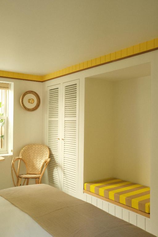 Postel nebo postele na pokoji v ubytování Hotel des Dunes
