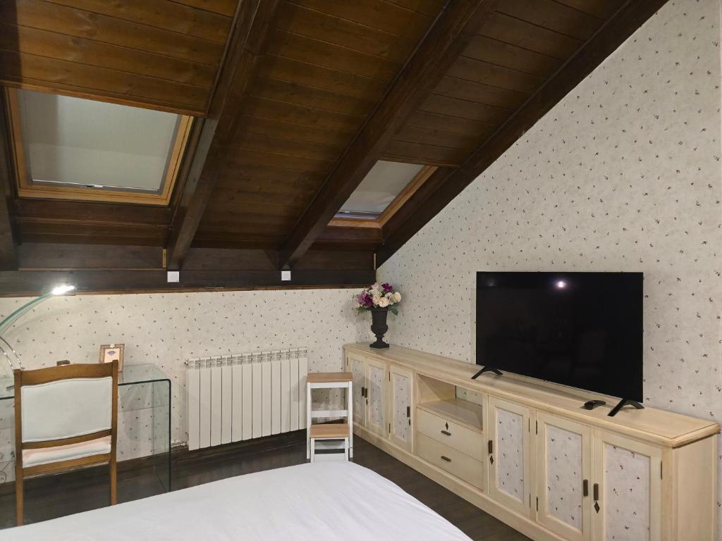 TV a/nebo společenská místnost v ubytování Un encanto de dúplex