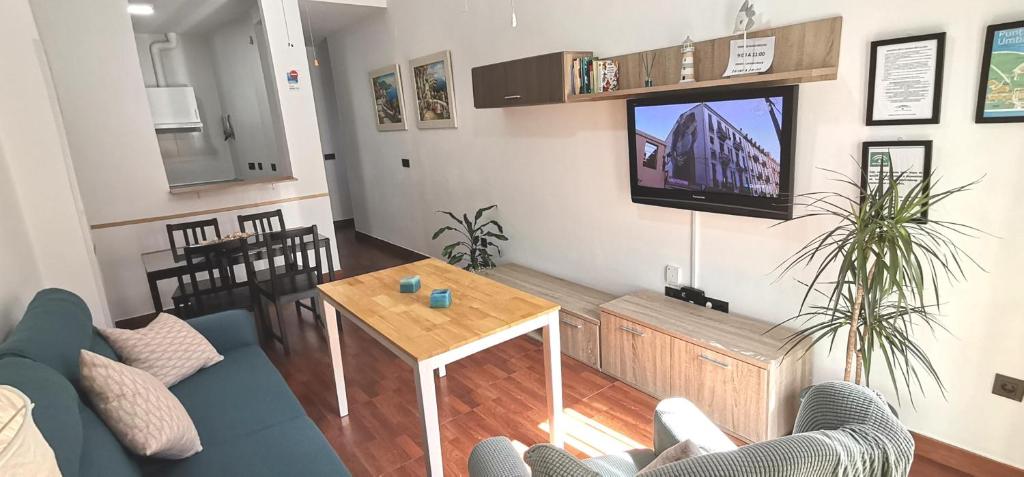 TV a/nebo společenská místnost v ubytování Delux Center Punta Umbría