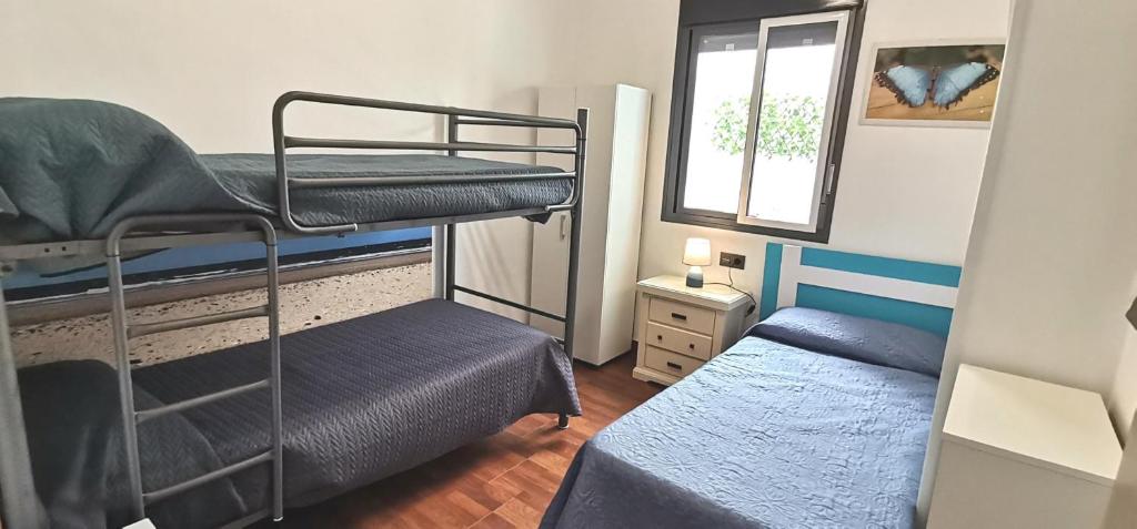 Postel nebo postele na pokoji v ubytování Delux Center Punta Umbría