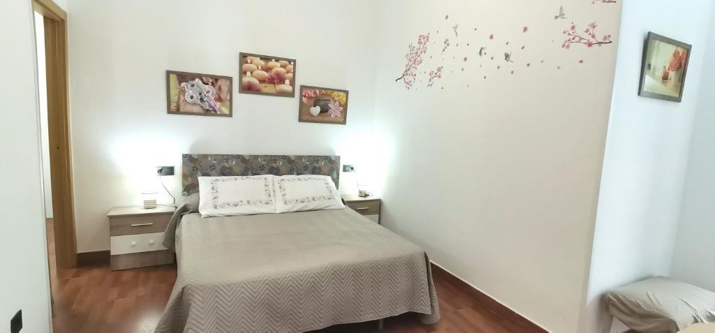 Postel nebo postele na pokoji v ubytování Delux Center Punta Umbría