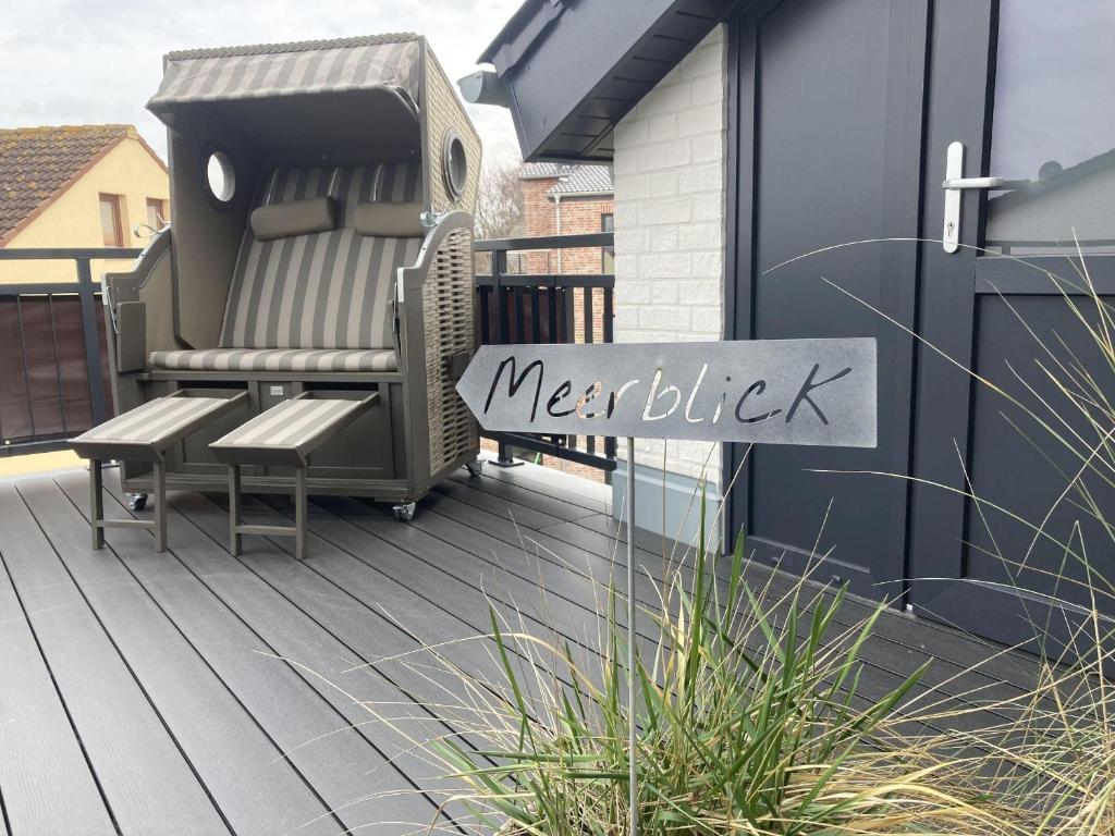 a sign that reads merkel on a deck at Dahmer-Duenen-Kuestenliebe in Dahme