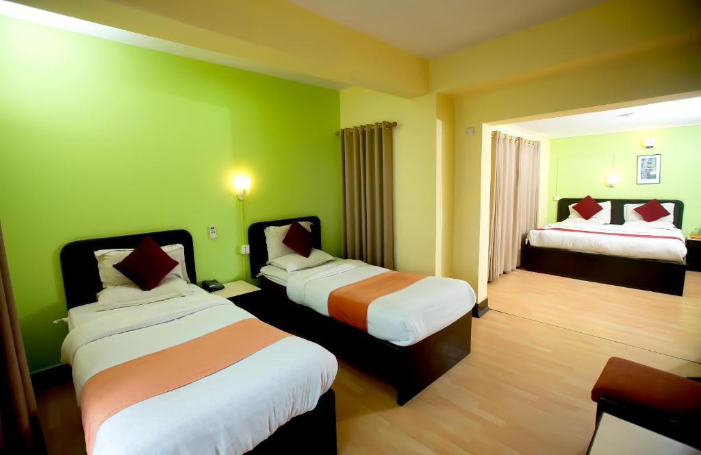 Postel nebo postele na pokoji v ubytování Sacred Boutique Hotel