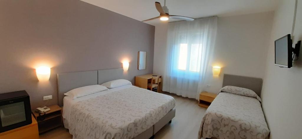 Postel nebo postele na pokoji v ubytování Albergo Centrale