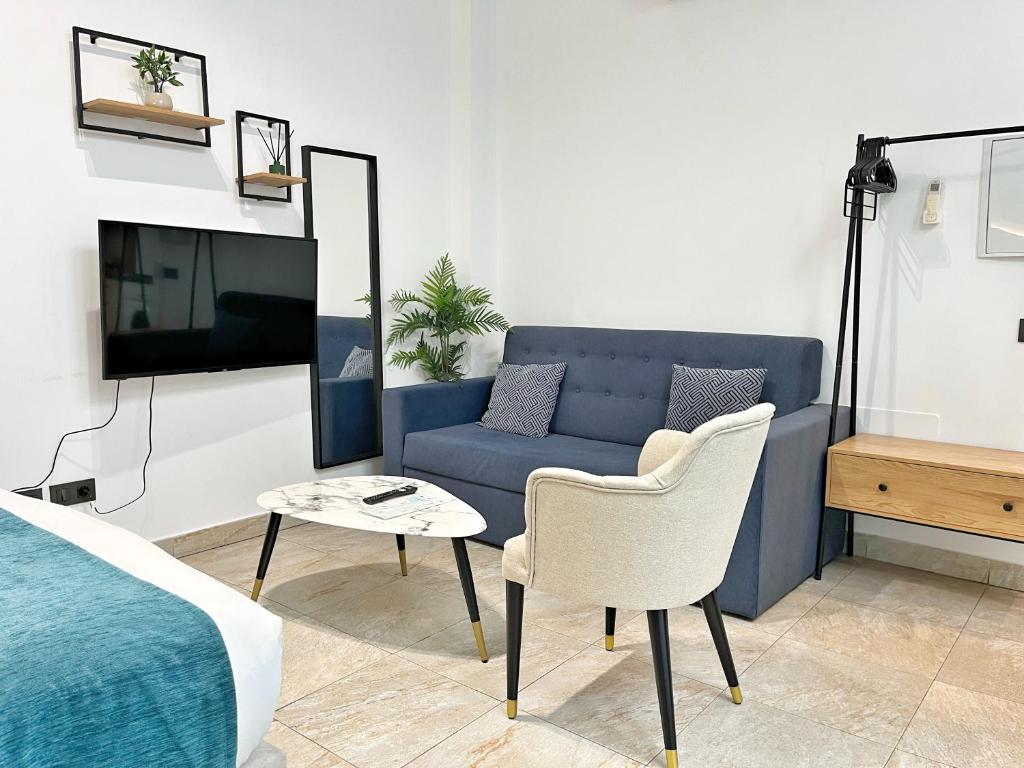 Televízia a/alebo spoločenská miestnosť v ubytovaní Tennessee Urban Suites