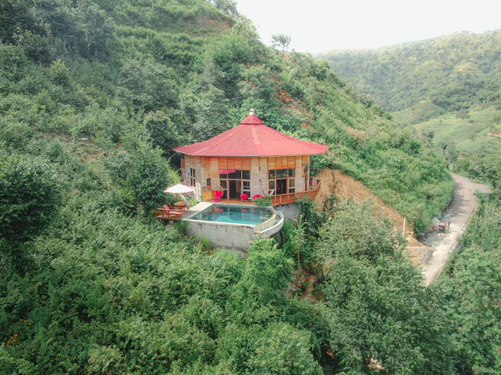 a house on a hill with a swimming pool at Villa Russerangan Grand Opening in Praya