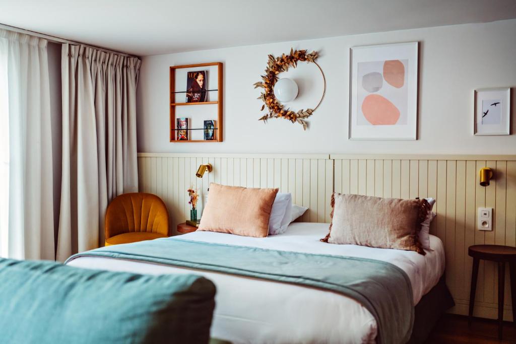 Postel nebo postele na pokoji v ubytování Hôtel Maison Lacassagne Lyon