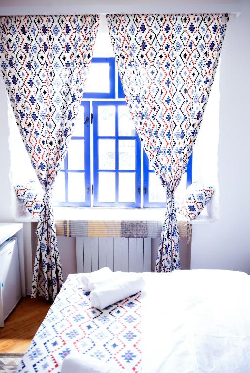 Postel nebo postele na pokoji v ubytování Pallada