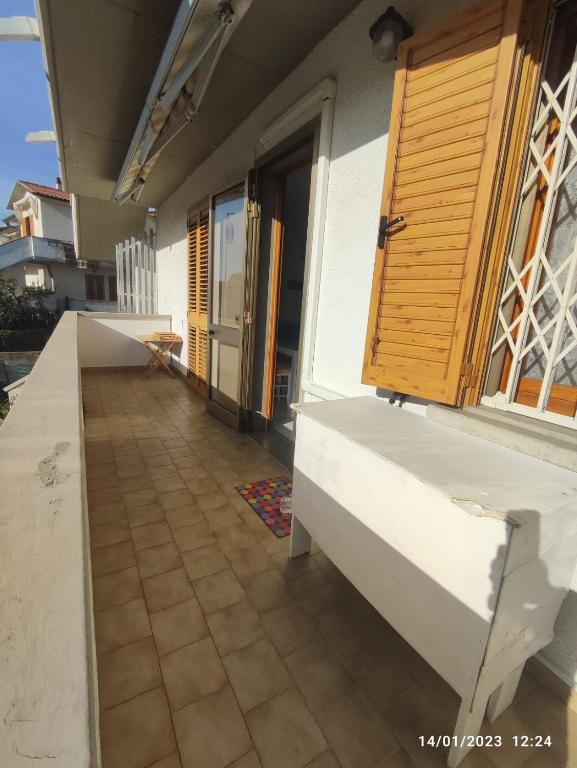 a balcony of a house with a counter and a window at La casa di Gabry in Vada