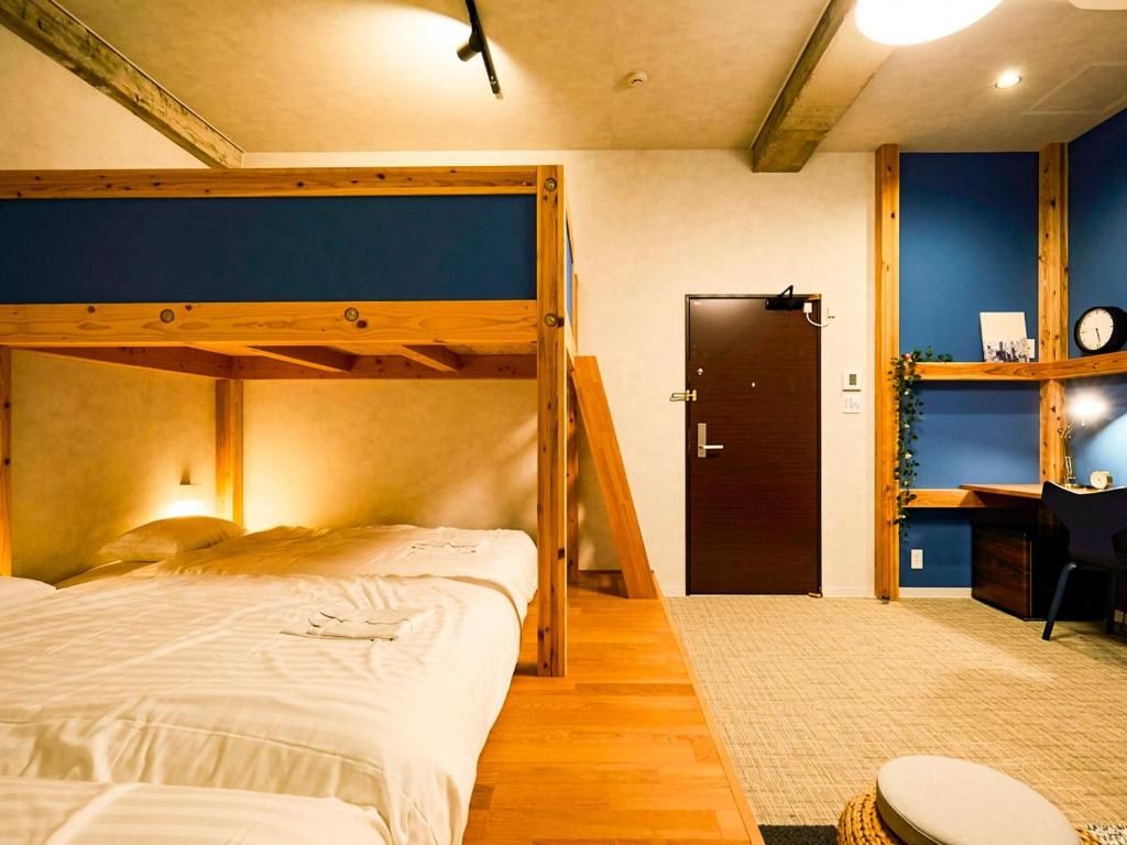 a bedroom with a bunk bed and a desk at Many Thanks Resort Onomichi - Vacation STAY 15793 in Onomichi