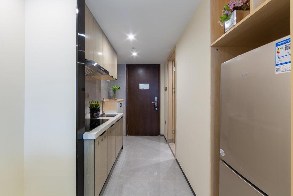 Kuchyň nebo kuchyňský kout v ubytování Serveyou International Apartment - Free Airport Pickup & Free Canton Fair Shuttle Bus