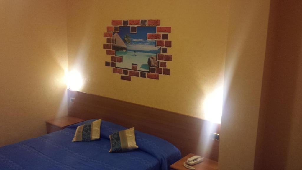 Postel nebo postele na pokoji v ubytování Hotel Residence Memmina