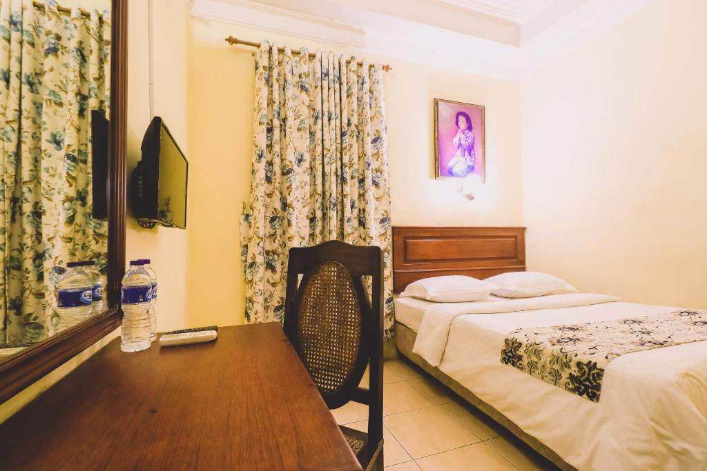 Postel nebo postele na pokoji v ubytování PIA Hotel Medan
