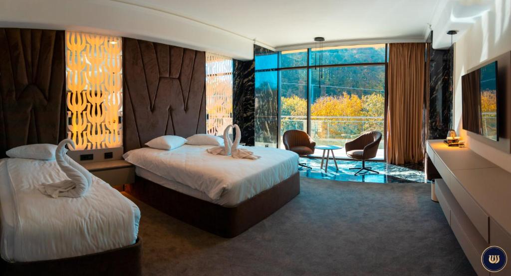 Postel nebo postele na pokoji v ubytování Wonderland Cluj Resort