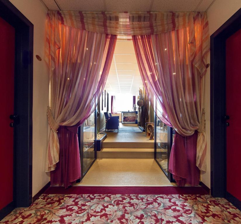 Postel nebo postele na pokoji v ubytování Hotel Terme Olympia