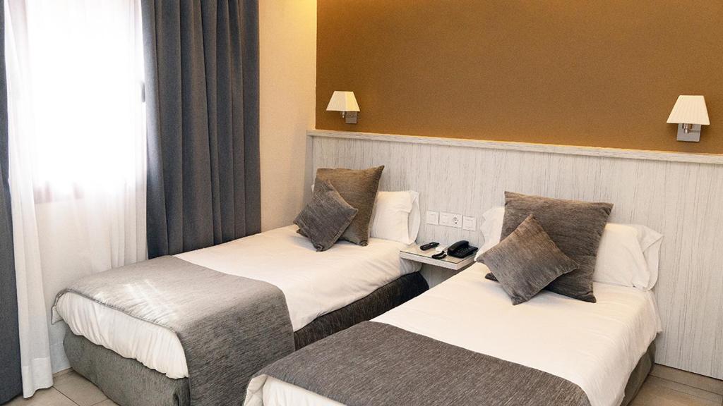 Postel nebo postele na pokoji v ubytování Hotel Coronado