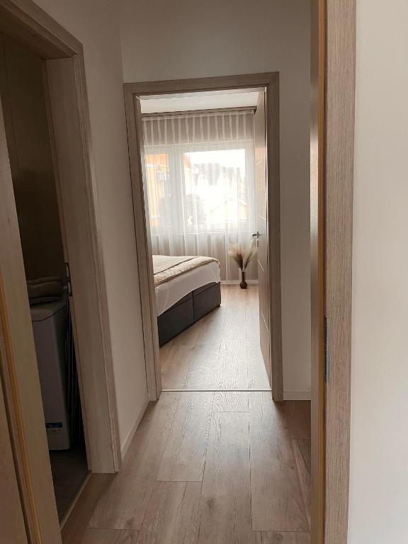 Posteľ alebo postele v izbe v ubytovaní Gréta Lux Apartman