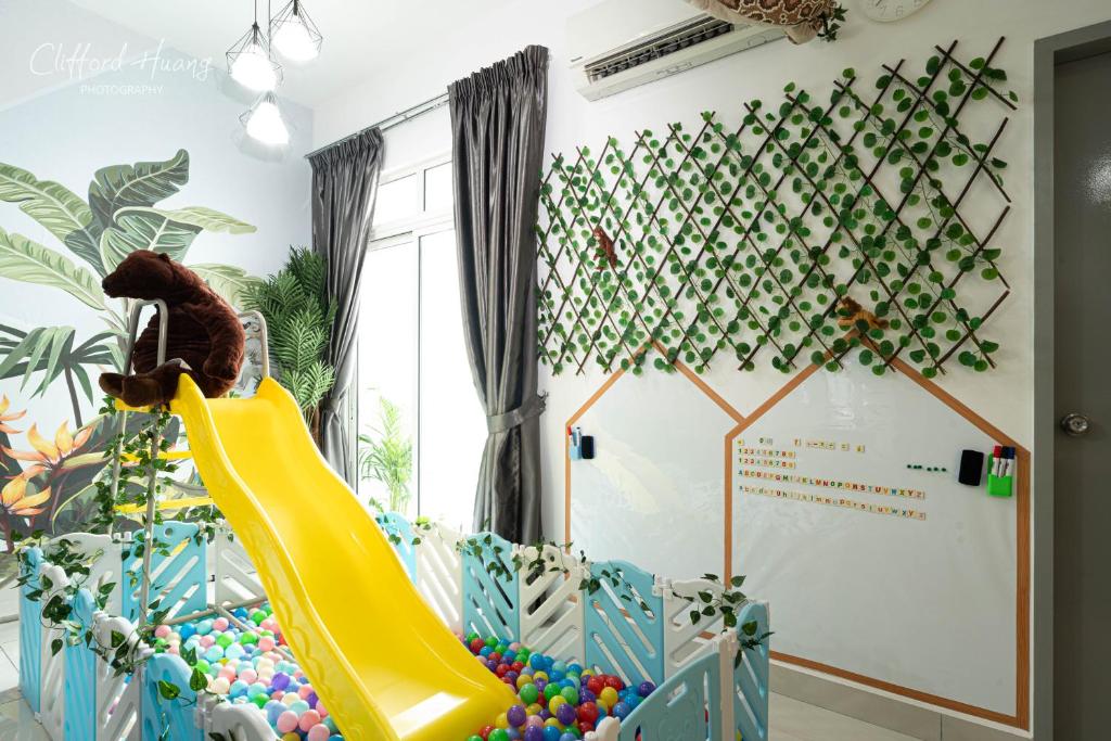 a childs play room with a slide and balls at Titiwangsa Monorial MRT LRT Station to Bukit Bintang Pavilion playground WTC HKL in Kuala Lumpur